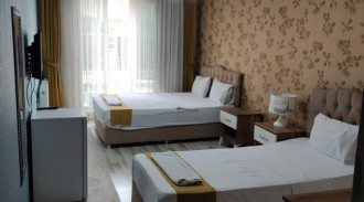 حجز غرفة بيج بوس وان بسريرين فرديين (2)