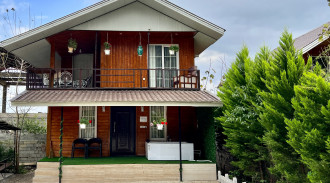 اجاره کلبه چوبی جکوزی دار با آلاچیق و تاب